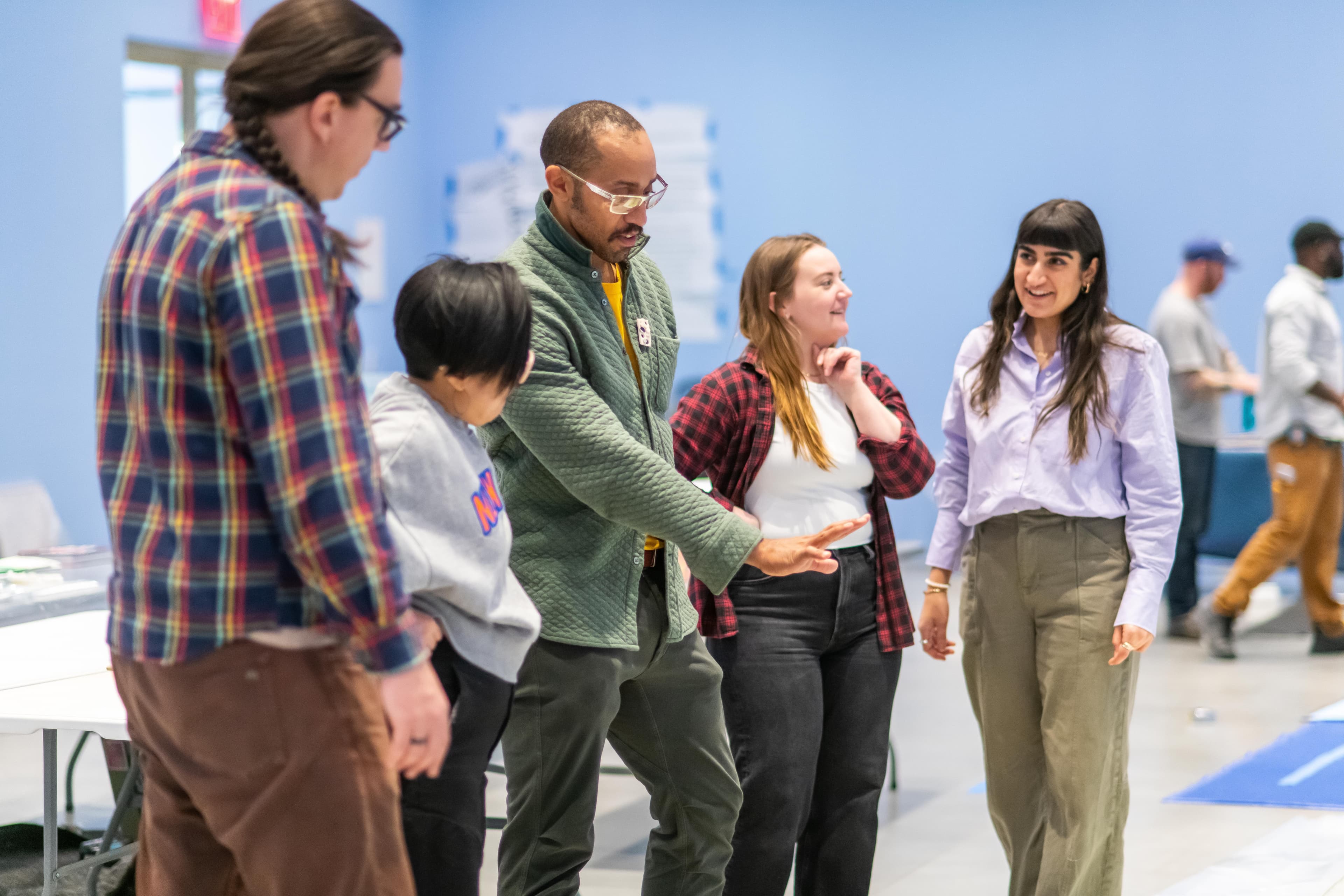 Team members collaborating together at an event