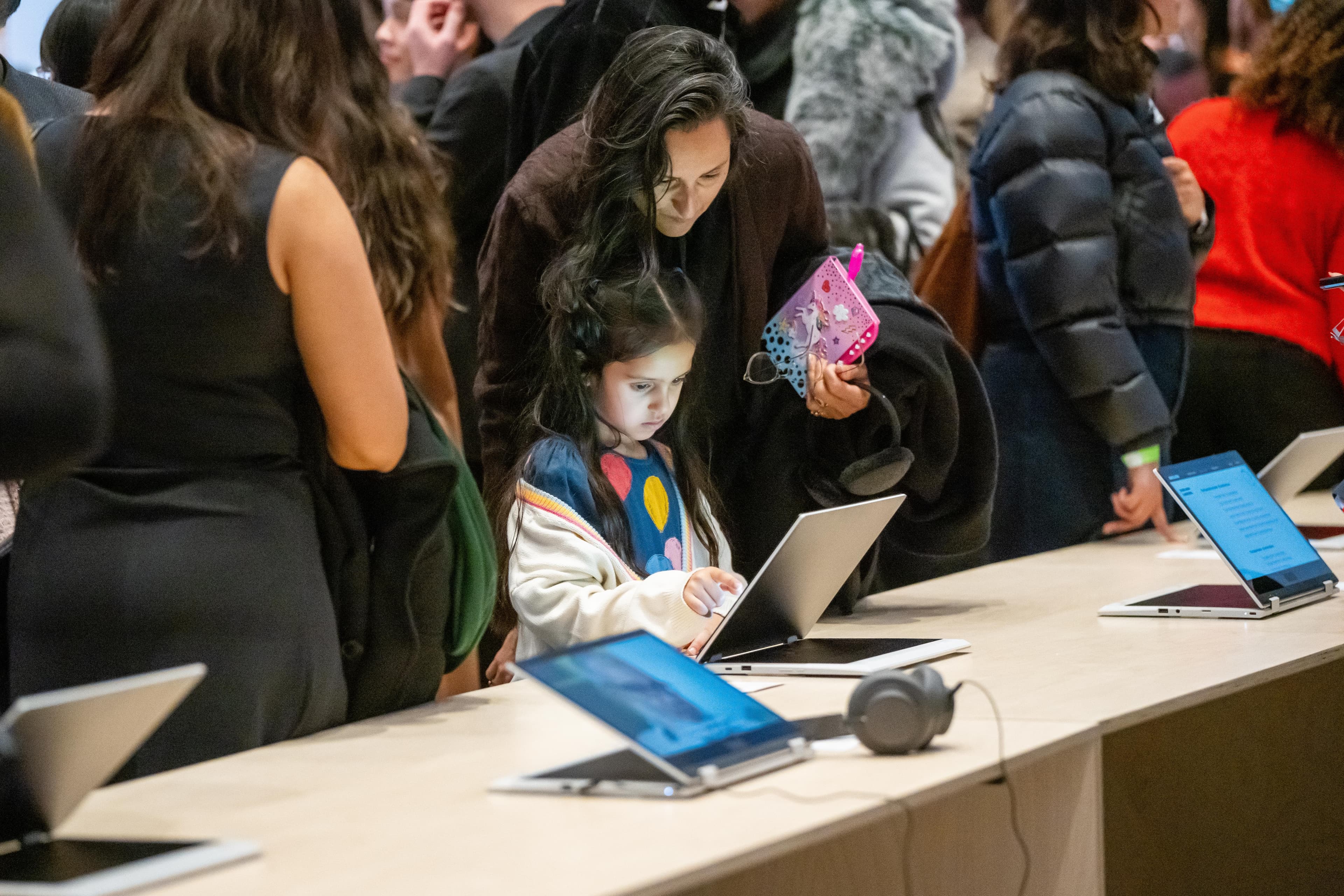 Little girl looking at an iPad at an event
